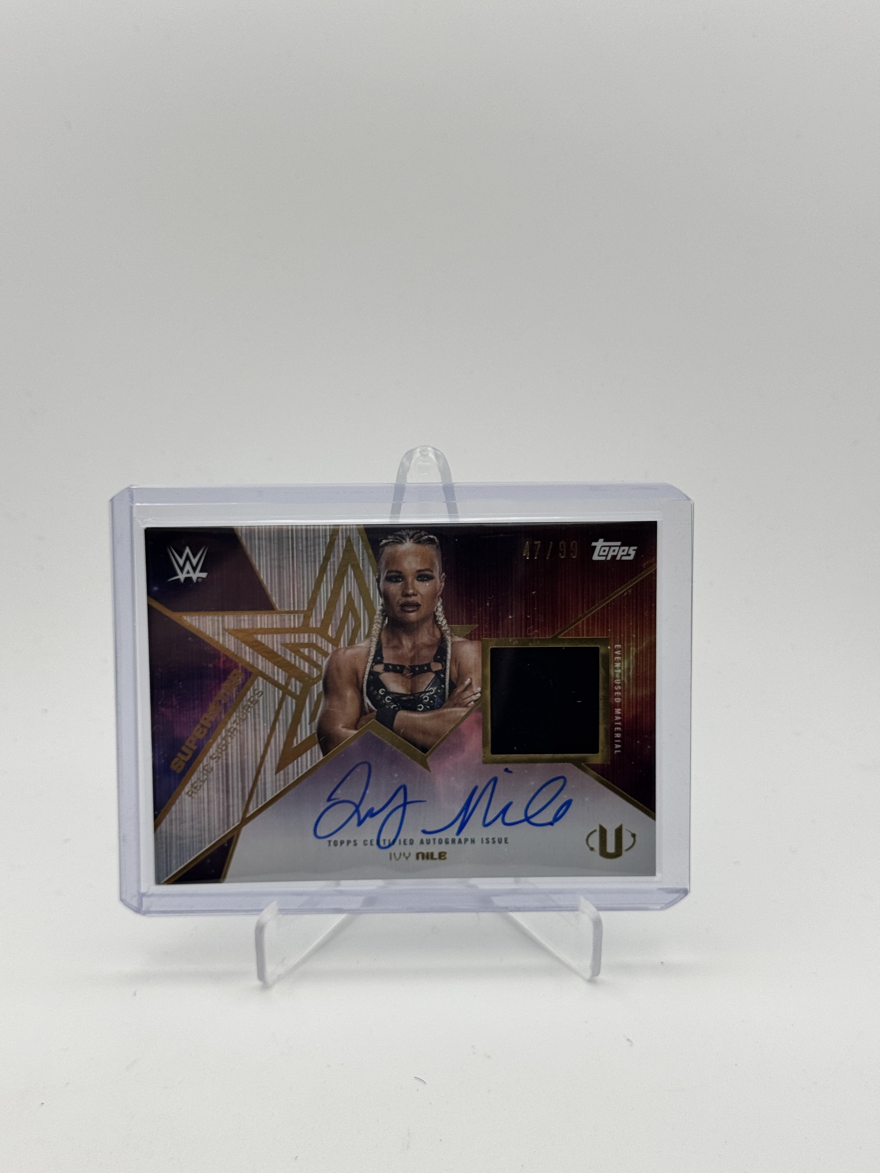 2025 Topps Universe WWE #SRS-INI Ivy Nile Superstar Relic Autograph Gold Stone