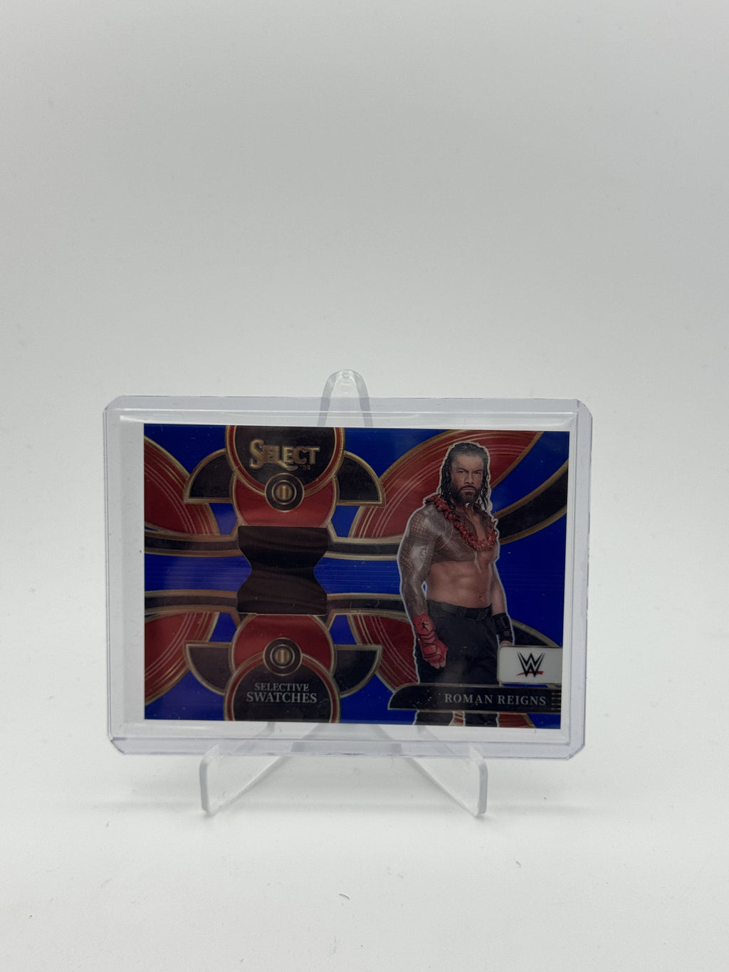 2024 Panini Select WWE #SW-RRN Roman Reigns Selective Swatches Blue Prizms #/49