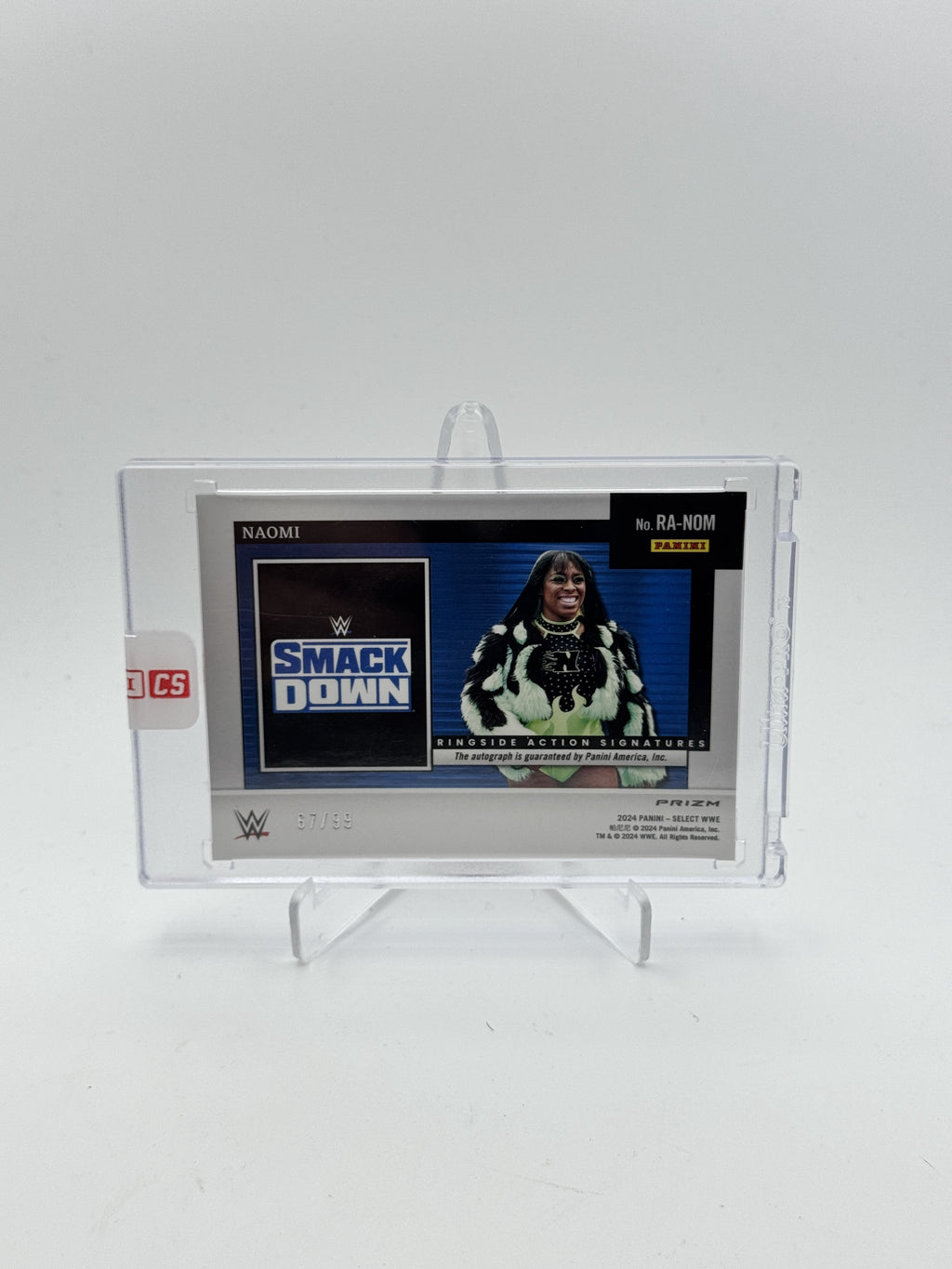2024 Panini Select WWE #TBD Naomi Ringside Action Signatures Red Prizms #/99